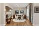 Elegant dining area with wood floors and modern chandelier at 144 Stone Mesa Ct, Henderson, NV 89011