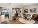 Elegant dining area with wood floors and modern chandelier at 144 Stone Mesa Ct, Henderson, NV 89011