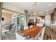 Modern dining room with a live-edge table and access to a patio at 144 Stone Mesa Ct, Henderson, NV 89011