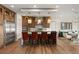 Modern kitchen with wood cabinets, quartz countertops, and stainless steel appliances at 144 Stone Mesa Ct, Henderson, NV 89011