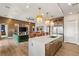 Modern kitchen with wood cabinets, quartz countertops and island seating at 144 Stone Mesa Ct, Henderson, NV 89011