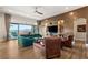 Luxury living room with a green sofa and built-in shelving at 144 Stone Mesa Ct, Henderson, NV 89011