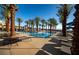 Relaxing pool area with palm trees and lounge chairs at 144 Stone Mesa Ct, Henderson, NV 89011