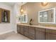 Elegant Primary bath with dual vanities and gold accents at 144 Stone Mesa Ct, Henderson, NV 89011