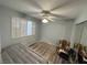 Bright bedroom with wood floors and ceiling fan at 1800 Edmond St # 132, Las Vegas, NV 89146