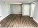 Bright living room with light gray walls and wood-look flooring at 1800 Edmond St # 132, Las Vegas, NV 89146