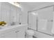 Bright bathroom features a vanity, toilet, and tub shower combo at 2136 Chertsey Dr # A, Las Vegas, NV 89108