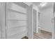 White shelving in hallway closet with additional storage at 2136 Chertsey Dr # A, Las Vegas, NV 89108