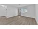 Bright and airy living room with vinyl plank flooring and access to the patio at 2136 Chertsey Dr # A, Las Vegas, NV 89108