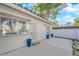 Private patio with blue planters and sliding glass doors at 2136 Chertsey Dr # A, Las Vegas, NV 89108