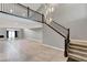 Open living area with high ceilings, a modern chandelier, and grey walls at 2204 Plaza De La Candela, Las Vegas, NV 89102