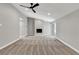 Bright living room with a fireplace, ceiling fan, and carpet at 2204 Plaza De La Candela, Las Vegas, NV 89102