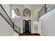 Open living area with high ceilings, a modern chandelier, and grey walls at 2204 Plaza De La Candela, Las Vegas, NV 89102