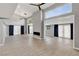 Spacious living room with high ceilings, a fireplace, and lots of natural light at 2204 Plaza De La Candela, Las Vegas, NV 89102