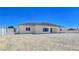 The back of the house features a neutral color scheme and sliding glass doors at 2280 S Pampa Ave, Pahrump, NV 89048