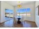 Dining area showcases a modern table, four chairs, and large windows that offer ample natural light at 2280 S Pampa Ave, Pahrump, NV 89048