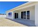 Exterior back view featuring a covered patio, and desert landscaping at 2280 S Pampa Ave, Pahrump, NV 89048