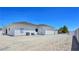 Rear exterior view shows neutral color scheme, AC units, and a fenced yard at 2280 S Pampa Ave, Pahrump, NV 89048