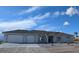 Beautiful single-story home boasts a three-car garage, well-maintained landscaping, and a neutral color palette at 2280 S Pampa Ave, Pahrump, NV 89048