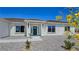 Inviting single-story home with desert landscaping, a covered entryway, and a bright green front door at 2280 S Pampa Ave, Pahrump, NV 89048