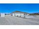 Front exterior with three-car garage and newly landscaped front yard at 2280 S Pampa Ave, Pahrump, NV 89048