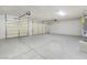 Spacious garage with multiple doors, ample parking, and durable concrete flooring at 2280 S Pampa Ave, Pahrump, NV 89048