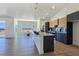 Modern kitchen features stainless steel appliances, marble counters, and light wood-grain floors at 2280 S Pampa Ave, Pahrump, NV 89048