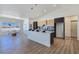 Stylish kitchen with a large island, stainless steel appliances, and an adjacent dining area at 2280 S Pampa Ave, Pahrump, NV 89048