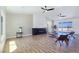 Bright living room with wood-grain floors, modern fireplace, and abundant natural light at 2280 S Pampa Ave, Pahrump, NV 89048