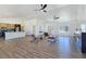 Spacious open-concept living room boasts wood-grain floors, modern fireplace, and abundant natural light at 2280 S Pampa Ave, Pahrump, NV 89048