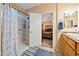 Bathroom with shower, double vanity, and view into bedroom at 2595 Fountain Ave, Pahrump, NV 89048