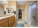 Double vanity bathroom with a walk-in shower and adjacent closet at 2595 Fountain Ave, Pahrump, NV 89048