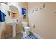 Clean and simple bathroom with pedestal sink and tile flooring at 2595 Fountain Ave, Pahrump, NV 89048