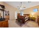 Main bedroom with wood furniture, a ceiling fan, and an ensuite bathroom at 2595 Fountain Ave, Pahrump, NV 89048