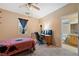 Bedroom with ceiling fan, closet and en-suite bathroom at 2595 Fountain Ave, Pahrump, NV 89048