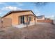 Relaxing patio area with pergola and seating for four at 2595 Fountain Ave, Pahrump, NV 89048