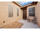 Side entrance with two chairs and small gravel area at 2595 Fountain Ave, Pahrump, NV 89048