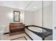 Modern bathroom featuring a soaking tub, granite counters, and a cherry vanity at 2700 Las Vegas Blvd # 3105, Las Vegas, NV 89109