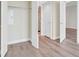 Hallway with wood floors leads to rooms and doors, including a view of the bathroom at 2700 Las Vegas Blvd # 3105, Las Vegas, NV 89109