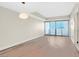 Bright living room with wood floors and sliding glass door with mountain views at 2700 Las Vegas Blvd # 3105, Las Vegas, NV 89109