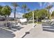 Inviting outdoor kitchen and dining area with lush landscaping and seating at 2700 Las Vegas Blvd # 3105, Las Vegas, NV 89109