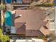 Aerial view of a home with a red tile roof and backyard pool at 3324 Canyon Lake Dr, Las Vegas, NV 89117