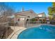 Backyard view of home with a fenced in pool and covered patio at 3324 Canyon Lake Dr, Las Vegas, NV 89117