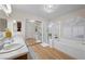 Bathroom with double sinks, vanity, glass enclosed shower, soaking tub, and natural light at 3324 Canyon Lake Dr, Las Vegas, NV 89117