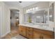 Bright bathroom features double sinks, spacious vanity, and large mirror at 3324 Canyon Lake Dr, Las Vegas, NV 89117