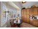 Cozy breakfast nook with wood floors, plantation shutters, built in cabinets, and natural light at 3324 Canyon Lake Dr, Las Vegas, NV 89117