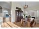 Dining area with a solid wood table and chairs and a dark wood china cabinet at 3324 Canyon Lake Dr, Las Vegas, NV 89117