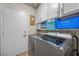 Functional laundry room with modern washer and dryer units at 3324 Canyon Lake Dr, Las Vegas, NV 89117