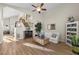 Comfortable living room with hardwood floors, a small sofa, and a charming staircase at 3324 Canyon Lake Dr, Las Vegas, NV 89117