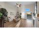 The comfortable living room features wood floors and a ceiling fan with access to the outdoor pool at 3324 Canyon Lake Dr, Las Vegas, NV 89117